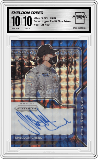 Sheldon Creed from the 2021 Panini Prizm NASCAR set featuring a  Hyper Red & Blue  parallel graded by Arena Club and given an overall grade of 10.