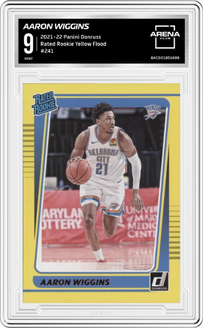 Aaron Wiggins from the 2021-22 Panini Donruss set featuring a Yellow Flood parallel graded by Arena Club and given an overall grade of 9.