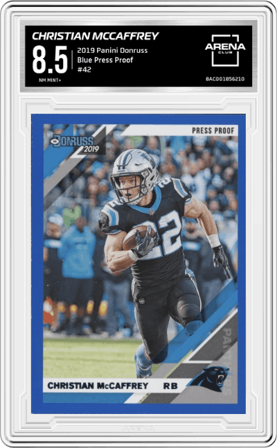 Christian McCaffrey from the 2019 Panini Donruss set featuring a Press Proof Blue parallel graded by Arena Club and given an overall grade of 8.5.