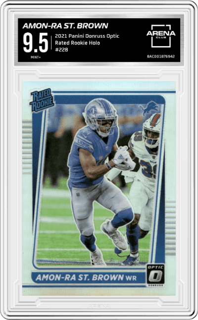 Amon-Ra St. Brown from the 2021 Panini Donruss Optic set featuring a Holo parallel graded by Arena Club and given an overall grade of 9.5.