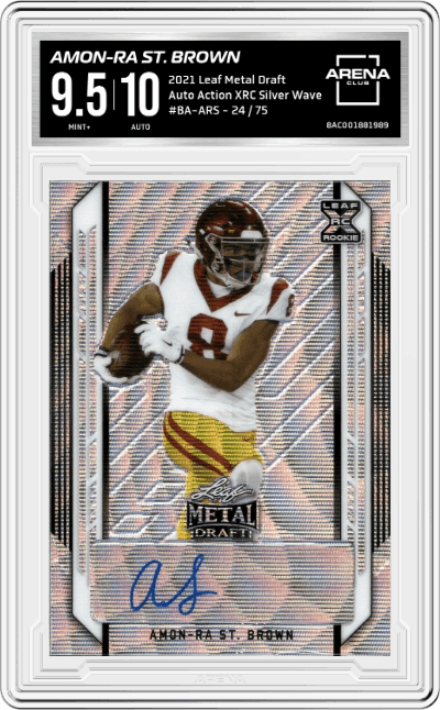 Amon-Ra St. Brown from the 2021 Leaf Metal Draft set featuring a Silver Wave parallel graded by Arena Club and given an overall grade of 9.5.