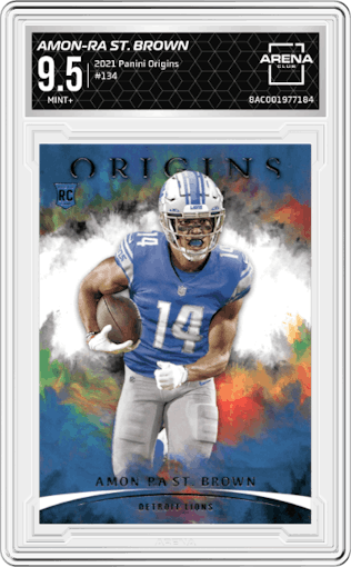 Amon-Ra St. Brown from the 2021 Panini Origins set graded by Arena Club and given an overall grade of 9.5.