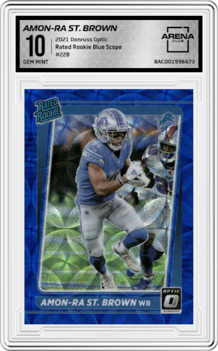 Amon-Ra St. Brown from the 2021 Panini Donruss Optic set featuring a Blue Scope parallel graded by Arena Club and given an overall grade of 10.