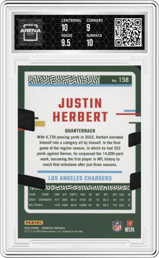 Justin Herbert from the 2023 Panini Donruss set featuring a Press Proof Silver Die-Cut parallel graded by Arena Club and given an overall grade of 9.5.