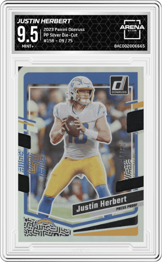 Justin Herbert from the 2023 Panini Donruss set featuring a Press Proof Silver Die-Cut parallel graded by Arena Club and given an overall grade of 9.5.