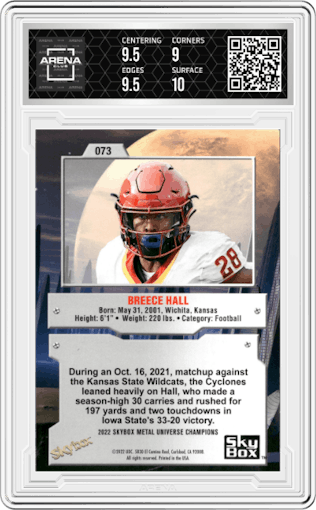 Breece Hall from the 2022 Skybox Metal Universe Champions Multi-Sport set featuring a Aqua parallel graded by Arena Club and given an overall grade of 9.5.