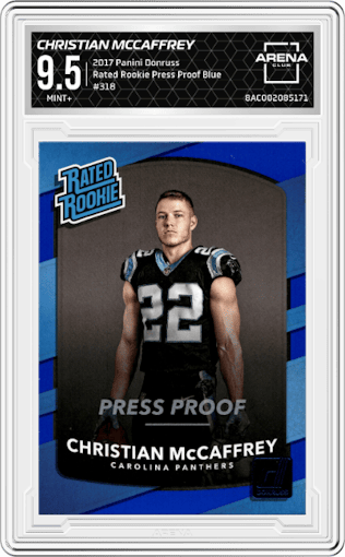 Christian McCaffrey from the 2017 Panini Donruss set featuring a Press Proof Blue parallel graded by Arena Club and given an overall grade of 9.5.