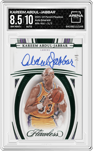 Kareem Abdul-Jabbar from the 2021-22 Panini Flawless set featuring a Emerald parallel graded by Arena Club and given an overall grade of 8.5.