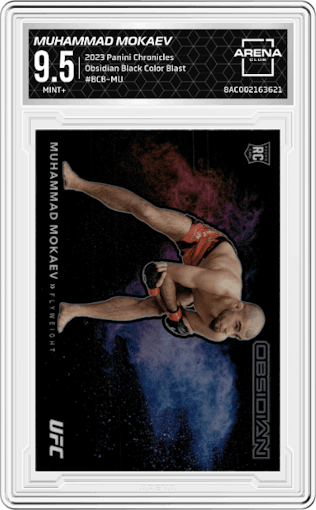 Muhammad Mokaev from the 2023 Panini Chronicles set featuring a Color Blast parallel graded by Arena Club and given an overall grade of 9.5.