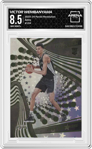 Victor Wembanyama from the 2023-24 Panini Revolution set featuring a Astro parallel graded by Arena Club and given an overall grade of 8.5.