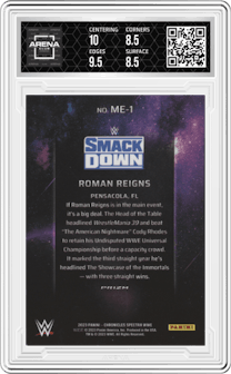 Roman Reigns from the 2023 Panini Chronicles WWE set and given an overall grade of 9.