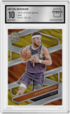 Devin Booker from the 2023-24 Panini Spectra set featuring a Gold parallel graded by Arena Club and given an overall grade of 10.