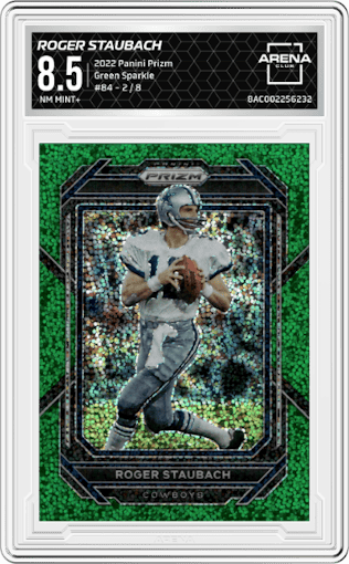 Roger Staubach from the 2022 Panini Prizm set featuring a Green Sparkle parallel graded by Arena Club and given an overall grade of 8.5.