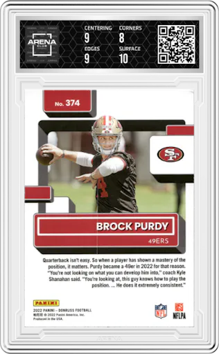 Brock Purdy from the 2022 Panini Donruss set featuring a Press Proof Blue parallel graded by Arena Club and given an overall grade of 8.5.