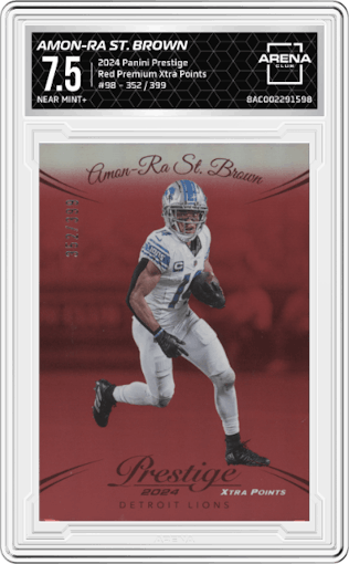Amon-Ra St. Brown from the 2024 Panini Prestige  set featuring a Red Premium Xtra Points parallel graded by Arena Club and given an overall grade of 7.5.