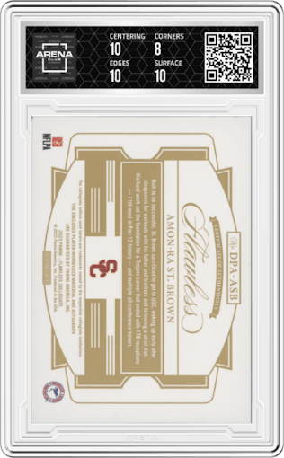 Amon-Ra St. Brown from the 2023 Panini Flawless Collegiate set graded by Arena Club and given an overall grade of 8.5.