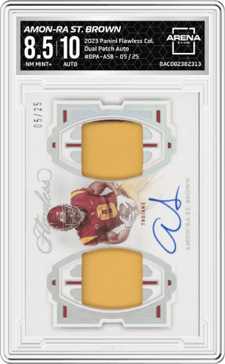 Amon-Ra St. Brown from the 2023 Panini Flawless Collegiate set graded by Arena Club and given an overall grade of 8.5.