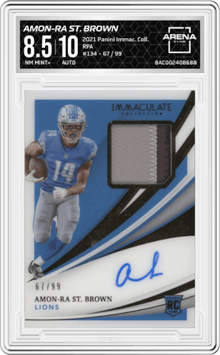 Amon-Ra St. Brown from the 2021 Panini Immaculate Collection set graded by Arena Club and given an overall grade of 8.5.