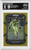 Tariq Woolen from the 2022 Panini Prizm set featuring a Gold Prizm parallel graded by Arena Club and given an overall grade of 8.