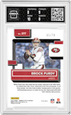 Brock Purdy from the 2022 Panini Donruss Optic set featuring a Pink Velocity parallel graded by Arena Club and given an overall grade of 8.5.