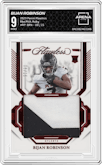Bijan Robinson from the 2023 Panini Flawless set featuring a Ruby parallel graded by Arena Club and given an overall grade of 9.