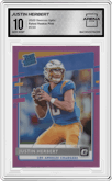 Justin Herbert from the 2020 Panini Donruss Optic set featuring a Pink parallel graded by Arena Club and given an overall grade of 10.