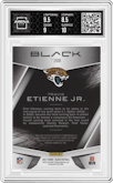 Travis Etienne Jr. from the 2021 Panini Black set featuring a Gold parallel graded by Arena Club and given an overall grade of 9.