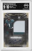 Travis Etienne Jr. from the 2021 Panini Black set featuring a Gold parallel graded by Arena Club and given an overall grade of 9.