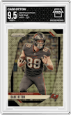 Cade Otton from the 2024 Panini Prizm set featuring a Gold Vinyl parallel graded by Arena Club and given an overall grade of 9.5.