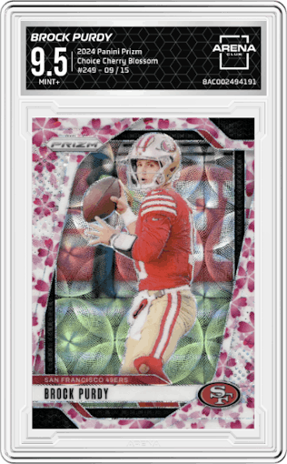 Brock Purdy from the 2024 Panini Prizm set featuring a Choice Cherry Blossom Prizm parallel graded by Arena Club and given an overall grade of 9.5.