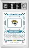 Brian Thomas Jr. from the 2024 Panini Photogenic set featuring a Orange parallel graded by Arena Club and given an overall grade of 9.5.