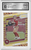 Brock Purdy from the 2024 Panini Absolute set featuring a Gold Spectrum parallel graded by Arena Club and given an overall grade of 10.