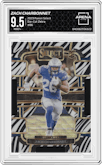 Zach Charbonnet from the 2023 Panini Select set featuring a Die-Cut Zebra Prizm parallel graded by Arena Club and given an overall grade of 9.5.