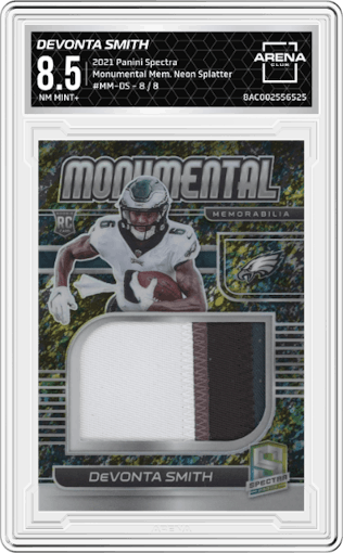 Devonta Smith from the 2021 Panini Spectra set featuring a Neon Splatter parallel graded by Arena Club and given an overall grade of 8.5.