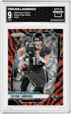 Trevor Lawrence from the 2024 Panini Prizm set featuring a Choice Tiger Stripe Prizm parallel graded by Arena Club and given an overall grade of 9.