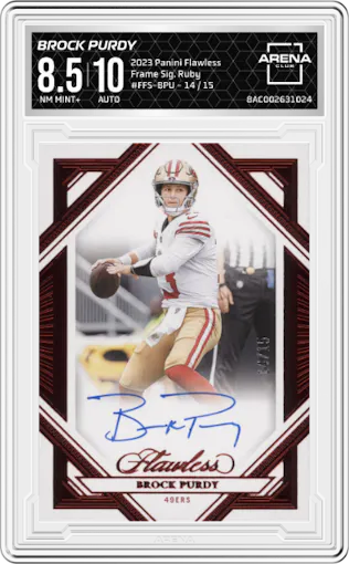 Brock Purdy from the 2023 Panini Flawless set featuring a Ruby parallel graded by Arena Club and given an overall grade of 8.5.