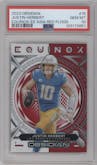 Justin Herbert from the 2023 Panini Obsidian set featuring a Electric Etch Asia Red Flood parallel graded by PSA and given an overall grade of 10.