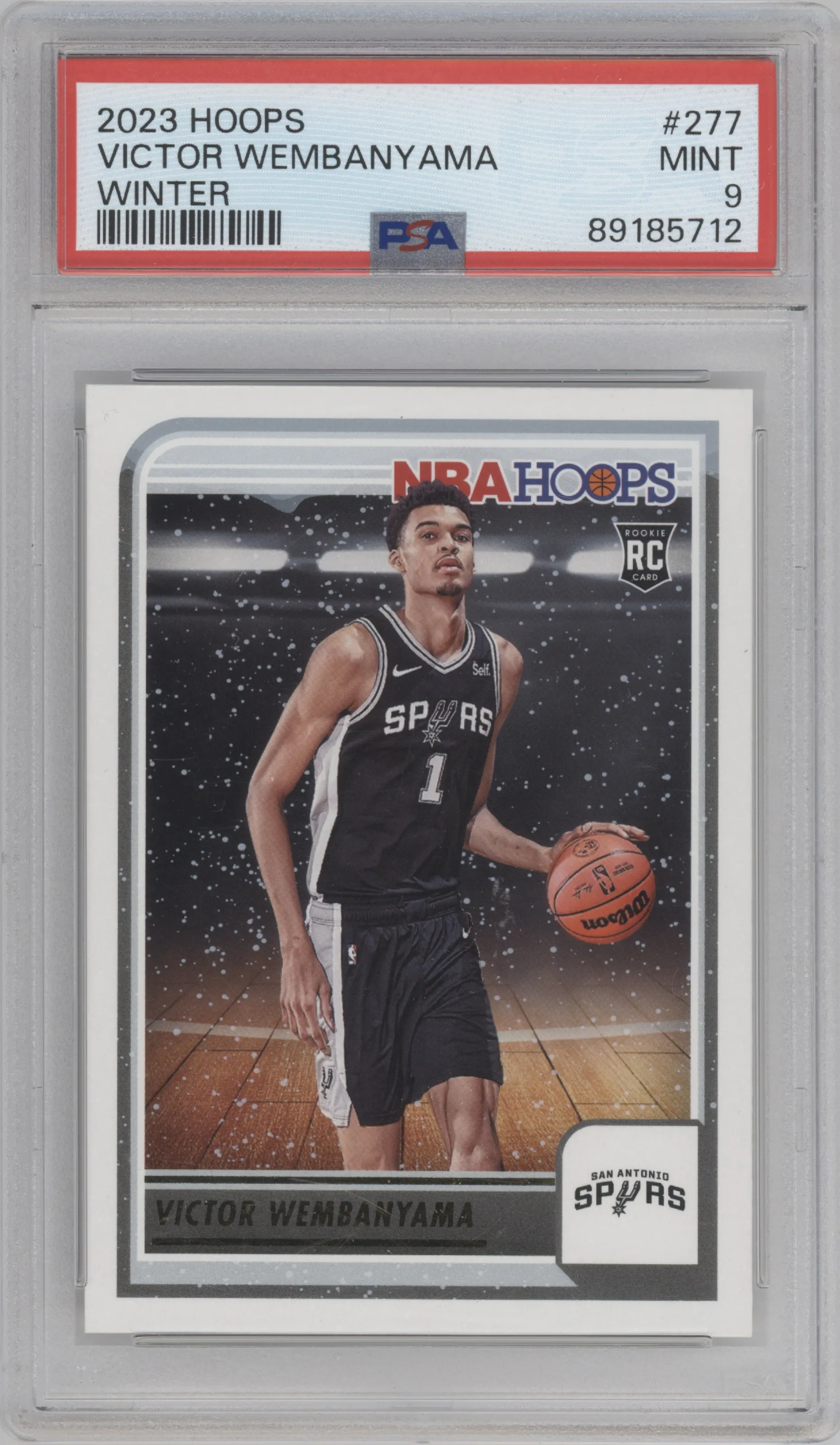 Victor Wembanyama from the 2023-24 Panini NBA Hoops set featuring a Winter parallel graded by PSA and given an overall grade of 9.