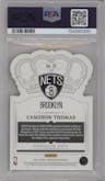 Cameron Thomas from the 2021-22 Crown Royale set featuring a Asia Lucky Envelopes parallel graded by PSA and given an overall grade of 8.