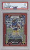 Puka Nacua from the 2023 Panini Prizm set featuring a Red Wave parallel graded by PSA and given an overall grade of 9.