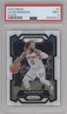 Jalen Brunson from the 2023-24 Panini Prizm set featuring a White Prizm parallel graded by PSA and given an overall grade of 9.