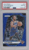 Jalen Brunson from the 2024-25 Panini Prizm set featuring a Choice Blue parallel graded by PSA and given an overall grade of 10.