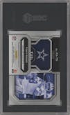 Tony Romo from the 2022 Panini Prizm set featuring a Blue Ice parallel graded by SGC and given an overall grade of 9.5.