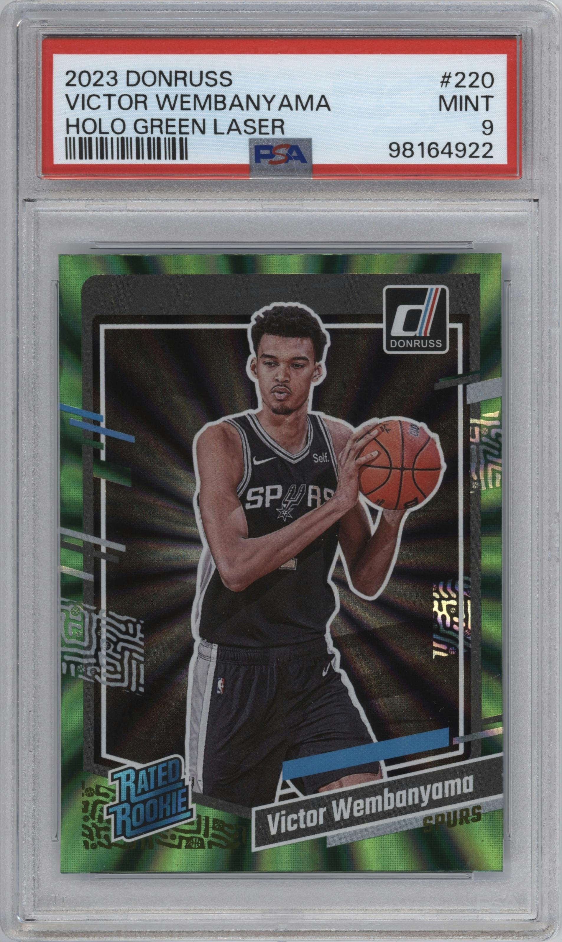 Victor Wembanyama from the 2023-24 Panini Donruss set featuring a Green Holo Laser  parallel graded by PSA and given an overall grade of 9.