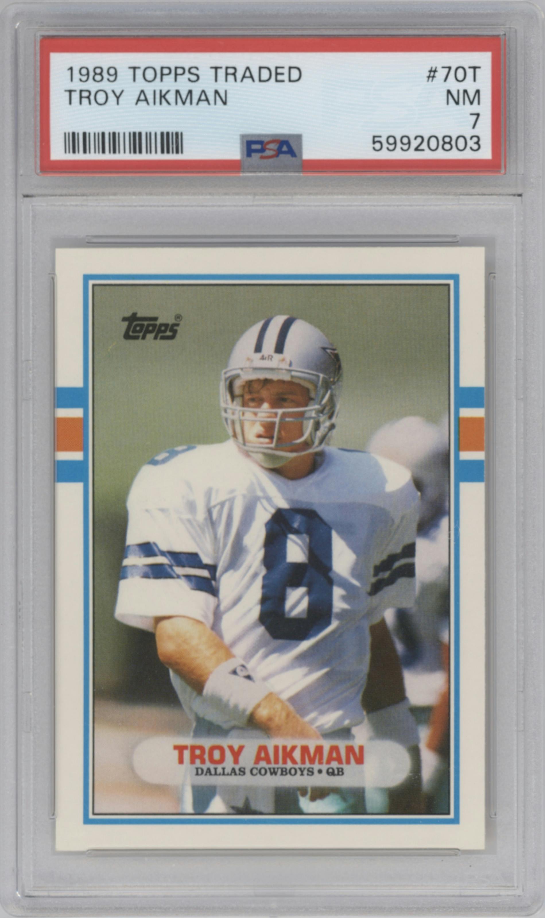 Troy Aikman from the 1989 Topps Traded set graded by PSA and given an overall grade of 7.