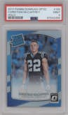 Christian McCaffrey from the 2017 Panini Donruss Optic set featuring a Holo parallel graded by PSA and given an overall grade of 9.