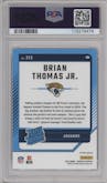 Brian Thomas Jr. from the 2024 Donruss set featuring a Red Pandora parallel graded by PSA and given an overall grade of 10.