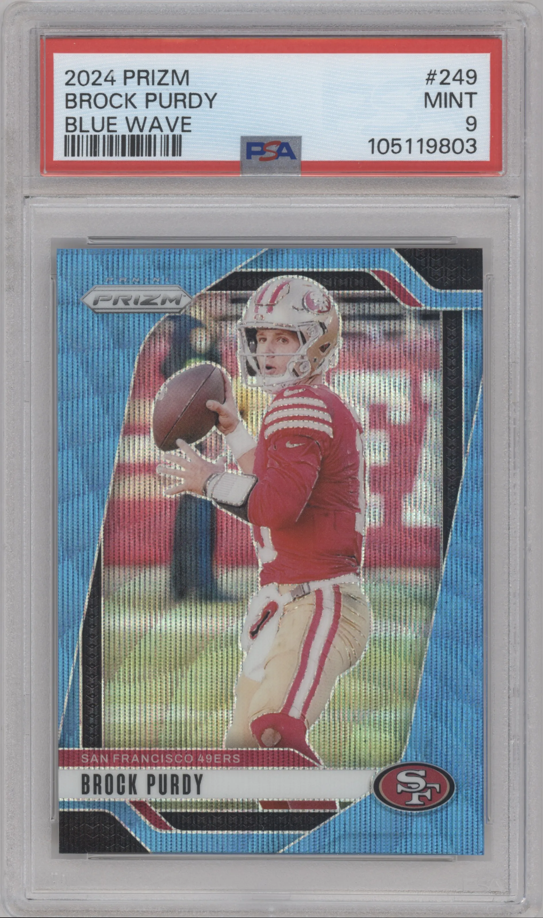 Brock Purdy from the 2024 Panini Prizm set featuring a Blue Wave Prizm parallel graded by PSA and given an overall grade of 9.