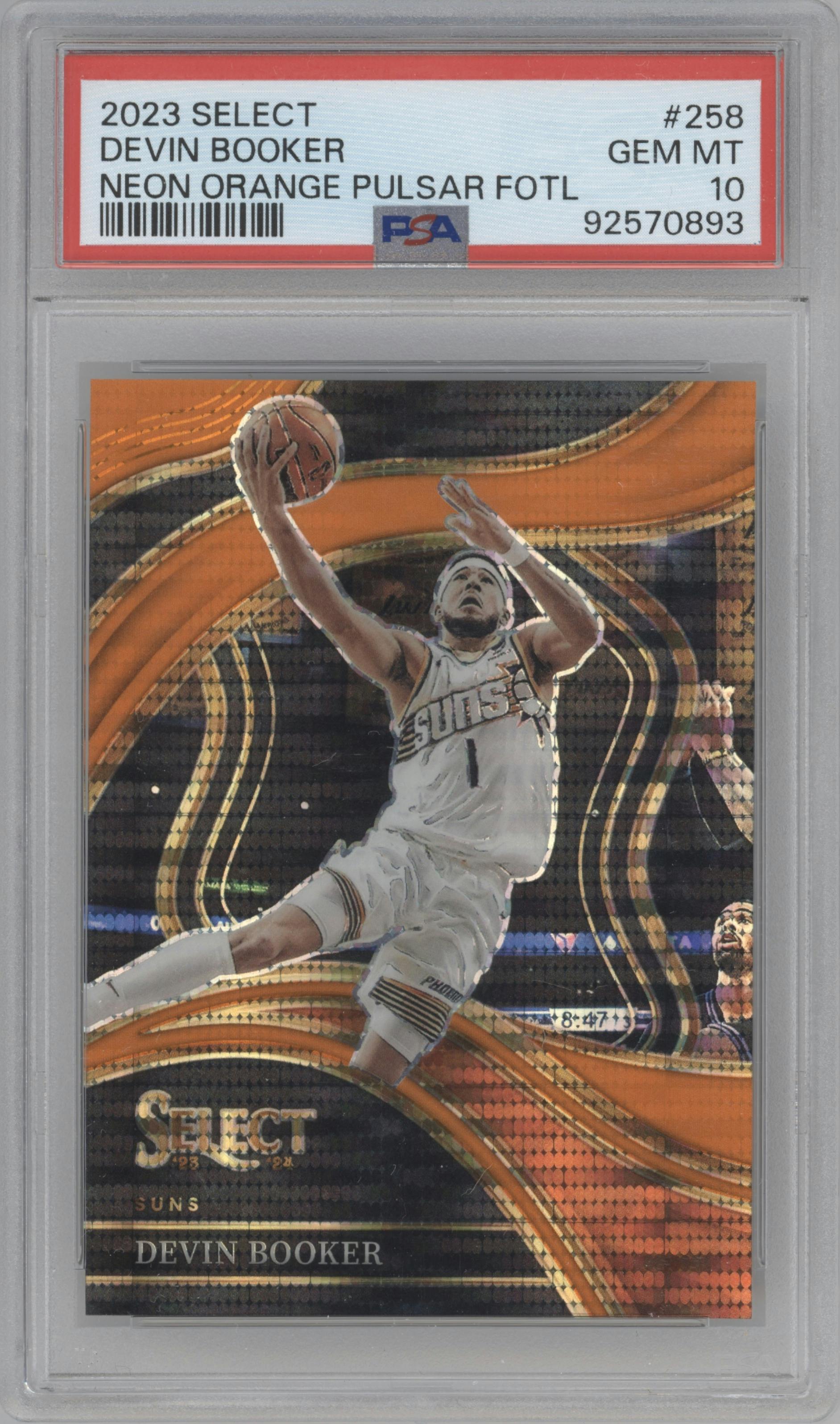 Devin Booker from the 2023-24 Panini Select  set featuring a Neon Orange Pulsar parallel graded by PSA and given an overall grade of 10.