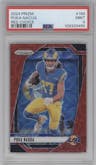 Puka Nacua from the 2024 Panini Prizm set featuring a Choice Red parallel graded by PSA and given an overall grade of 9.